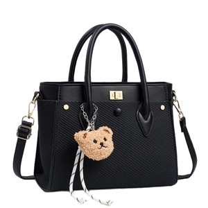 Retro black PU leather handbag with gold metal lock and brown plush bear charm