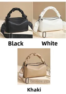Detailed view of luxury pillow bags in black, white, and khaki with pleated handles