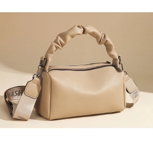 Detail of khaki Boston bag featuring ruched handle and wide FASH branded strap