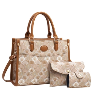 Three-piece tote bag set with jacquard pattern and brown leather trim on white background