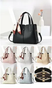 Litchi pattern leather handbag detail showing metal feet and six color options with scarves
