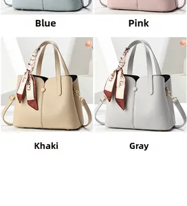 Litchi pattern handbags in four colors with decorative silk scarves on handles