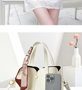 Close-up of beige lychee leather bag with decorative silk scarf and size reference