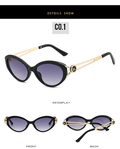 Detailed view of cat eye sunglasses featuring gold hollow metal temples and gradient lenses