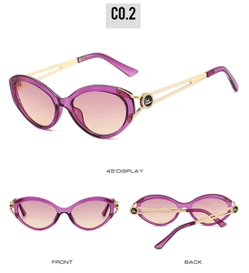 Detail of cat-eye sunglasses with purple frames, gradient lenses and hollow metal temples
