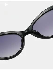 Detail of comfortable integrated nose pads on black cat-eye sunglasses with purple lenses