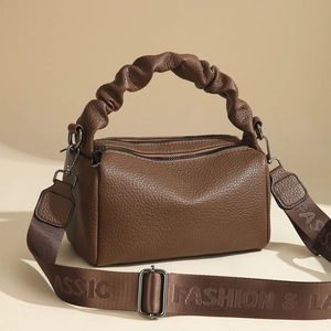 Dark brown lychee pattern cylinder crossbody bag with pleated handle and wide strap