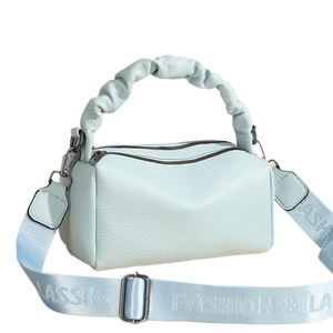 Light blue crossbody bag with a ruched top handle and printed fashion nylon strap