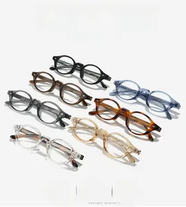 Macro shot of TR90 round vintage glasses in multiple colors with reinforced metal temple detail