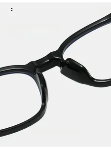 Detail of ergonomic black glasses frame showing integrated comfortable nose pads