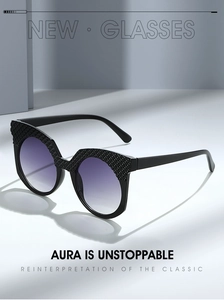 Detailed view of black textured cat-eye sunglasses with purple gradient lenses