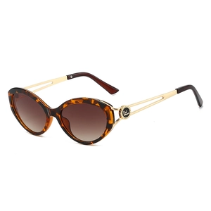 Cat eye tortoiseshell sunglasses with gold metal hollow temples shown from a 45-degree angle