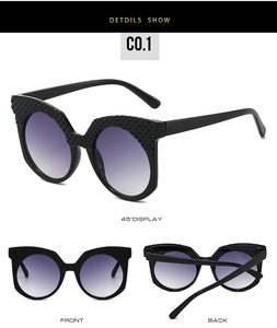 Detail views of black cat-eye sunglasses with quilted texture and purple gradient lenses