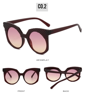 Detailed views of burgundy cat-eye sunglasses with gradient lenses and embossed frames
