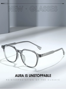 Detail of transparent grey polygonal eyeglass frames with silver hinge accents