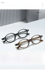 Close-up of retro round TR90 glasses frames in black and tortoiseshell with star studs