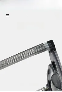 Detail of grey translucent eyewear temple showing silver engraved metal core