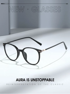 Close-up of black round frame glasses featuring distinctive tricolor temple hinge details