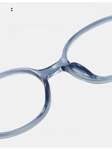Detail view of transparent blue TR90 glasses frames featuring comfortable nose pads