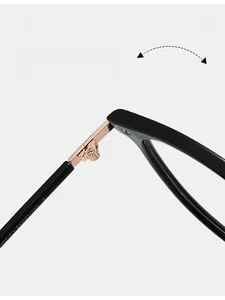 Macro detail of rose gold metal hinges and size specs on black eyeglass frames