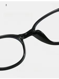 Close-up of comfortable integrated nose pads on black minimalist glasses frame