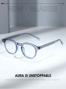 Macro detail of transparent blue round glasses frame with metallic embossed temples