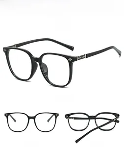 Detail of black square oversized glasses frames with silver gothic cross on the temple