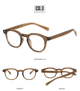 Detailed views of transparent brown round frame glasses with ornate metal temple relief