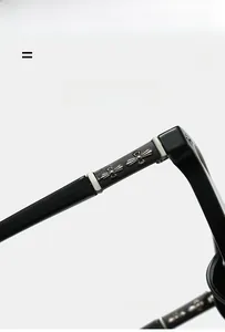 Detail of black eyewear temples featuring vintage silver cross metal hardware and texture