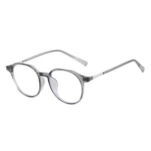 Occhiali rotondi classici anti luce blu con montatura grigio trasparente e stine in metallo