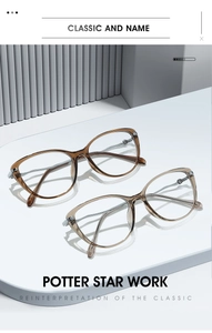 Cat-eye glasses frames in amber and champagne colors displayed on white pedestals