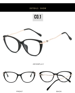 Detail view of black cat-eye glasses frame with wavy golden metal arms and brand logo