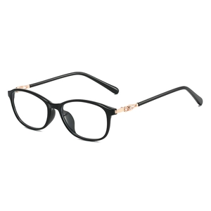 Classic black oval eyewear frame with gold metal accents shown from a side perspective