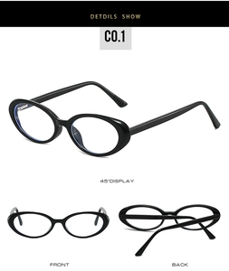 Detail view of stylish black oval glasses with spring hinges and glossy frames