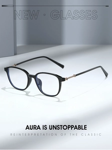 Detail of black full-rim glasses with golden clover accents on slim metal temples