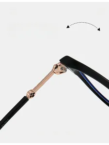 Detail of metal hinge with flower motif on black and gold stainless steel glasses frame