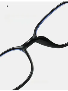 Macro detail of high bridge integrated nose pads on black minimalist glasses frame