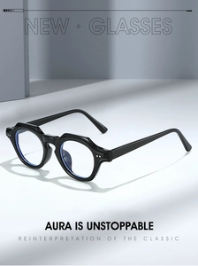 Détail de lunettes noires rondes géométriques avec verres anti-lumière bleue et rivets