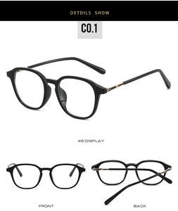 Close-up of black retro glasses frame with gold interlocked G metal hinge detail
