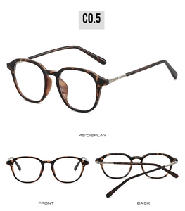 Detailed close-up of tortoise round frame glasses with gold hardware and logo on temples
