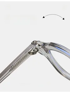 Détail macro de la charnière métallique durable intégrée dans une monture transparente