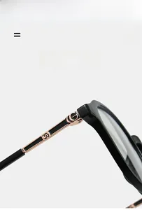 Detail of super elastic black temples with gold interlocking logo on stylish glasses