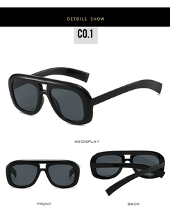 Detail view of large frame double bridge sunglasses with black frames and smoke lenses