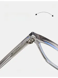 Detailed macro view of durable metal hinge on transparent square eyeglass frames