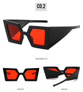 Detail view of bold black geometric frames with vibrant red lenses from multiple angles