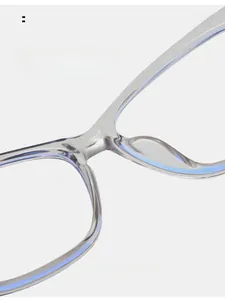 Detailed macro shot of the integrated nose pads on transparent grey cat-eye glasses