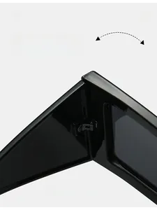 Close-up of durable metal hinge on black oversized sunglasses with glossy finish