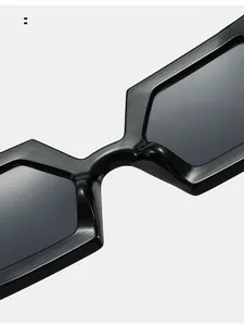 Detailed macro view of the integrated nose pads on black oversized fashion sunglasses