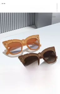 Detail showing two pairs of retro square sunglasses in amber and coffee tortoiseshell finish