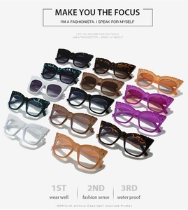 Flat lay of square chunky sunglasses in 12 colors including tortoiseshell and marble patterns